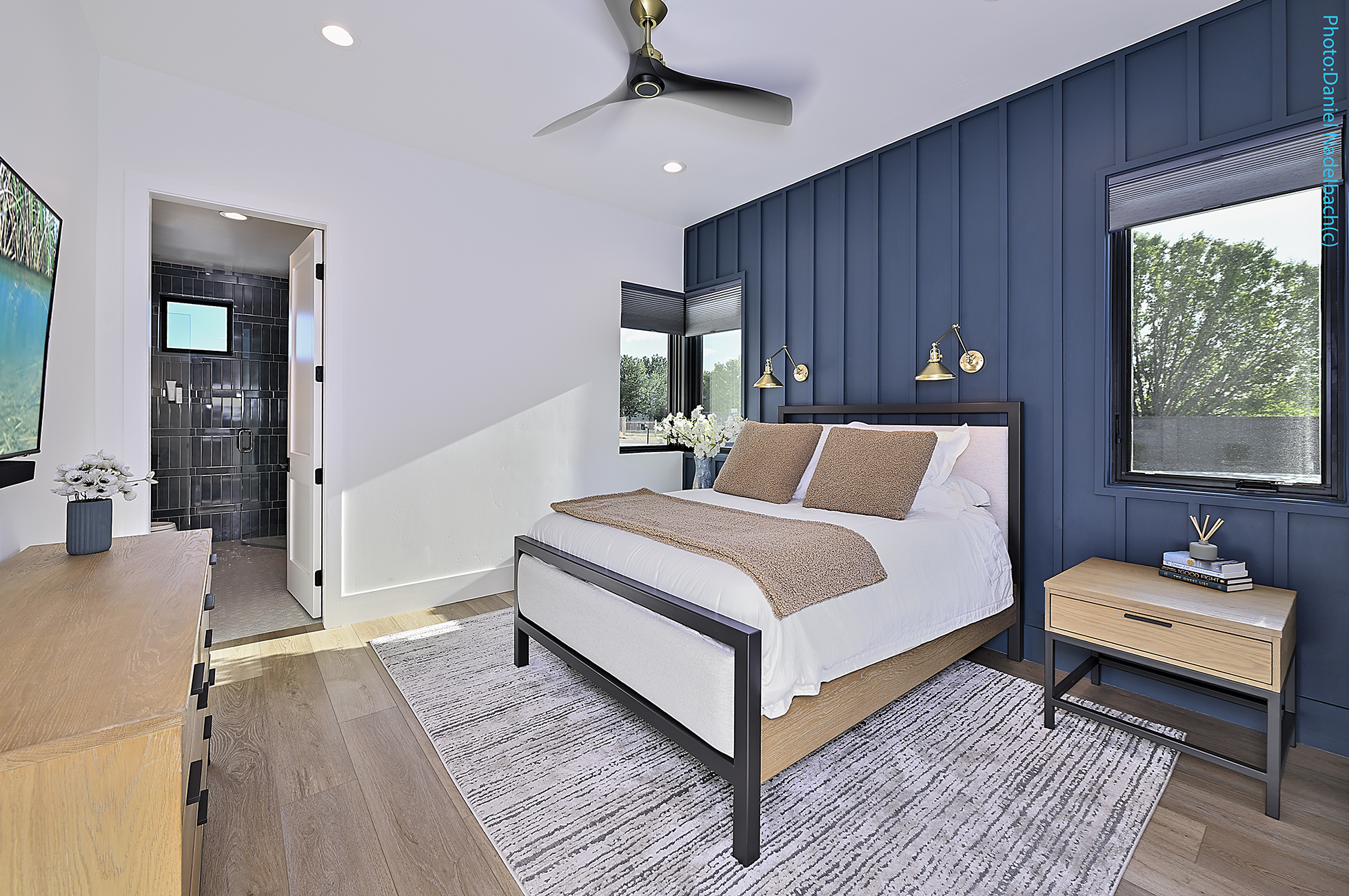 Guest bedroom with navy accent wall